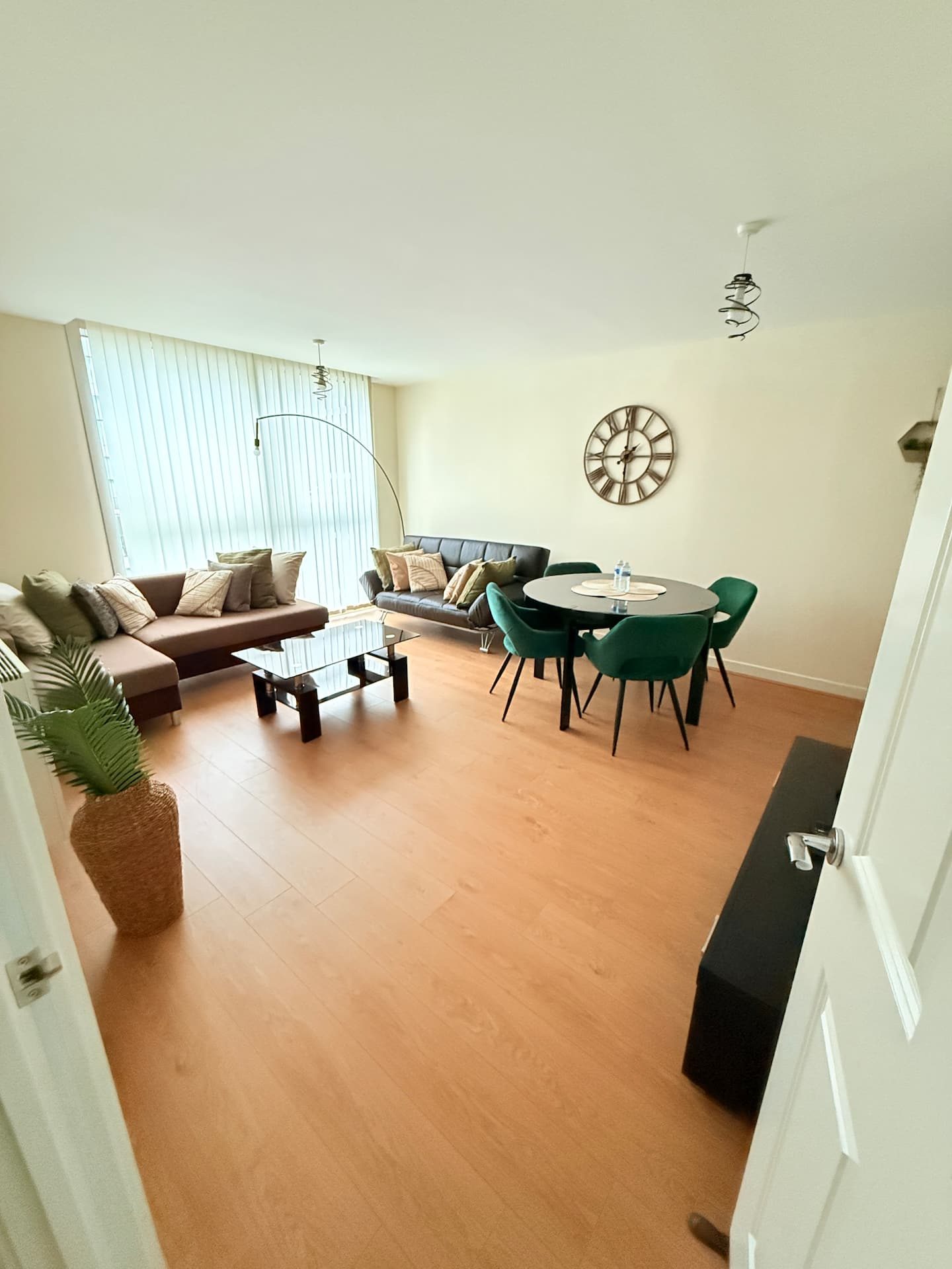 Living and dining area with the tall windows